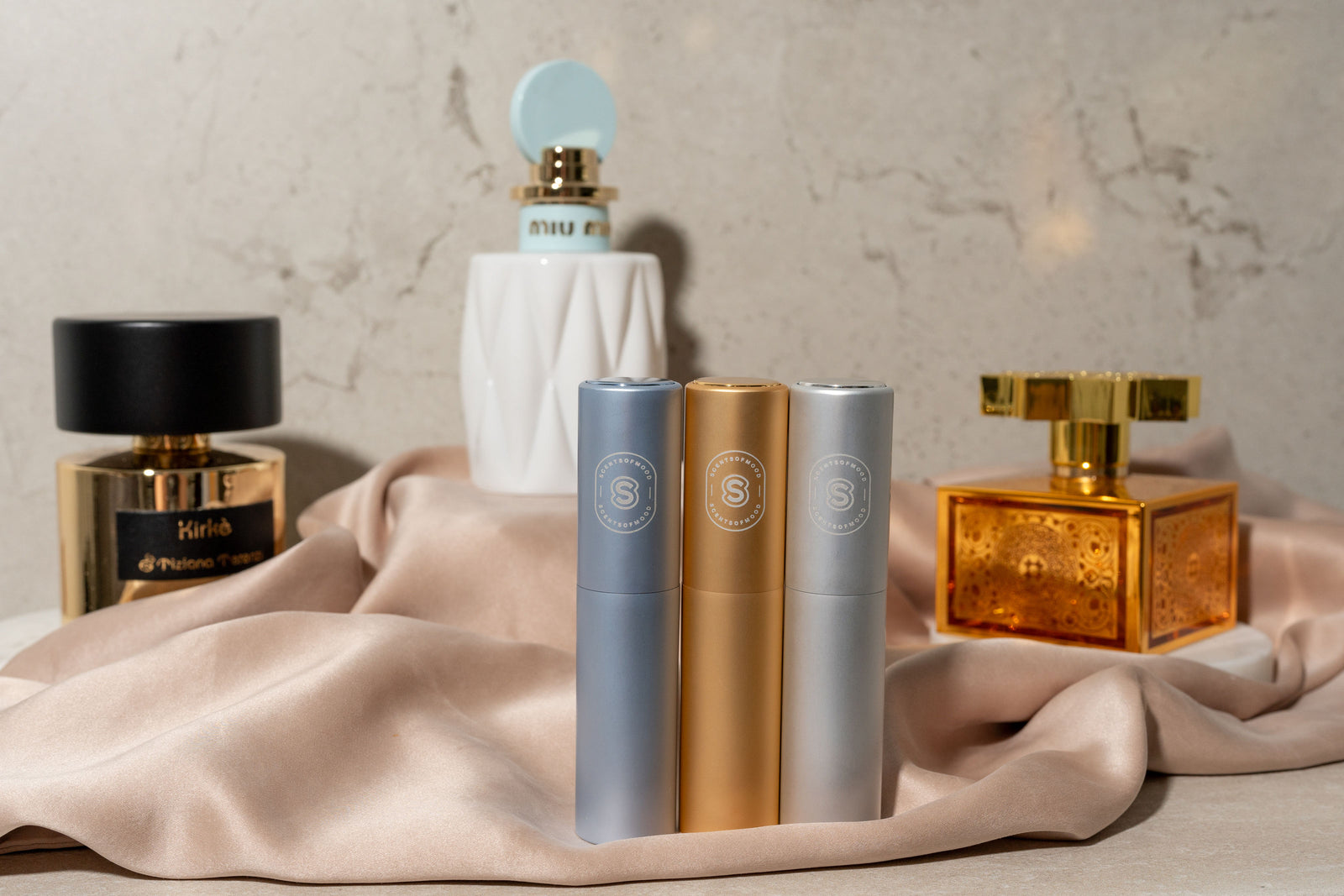 Atomizers on champagne silk
